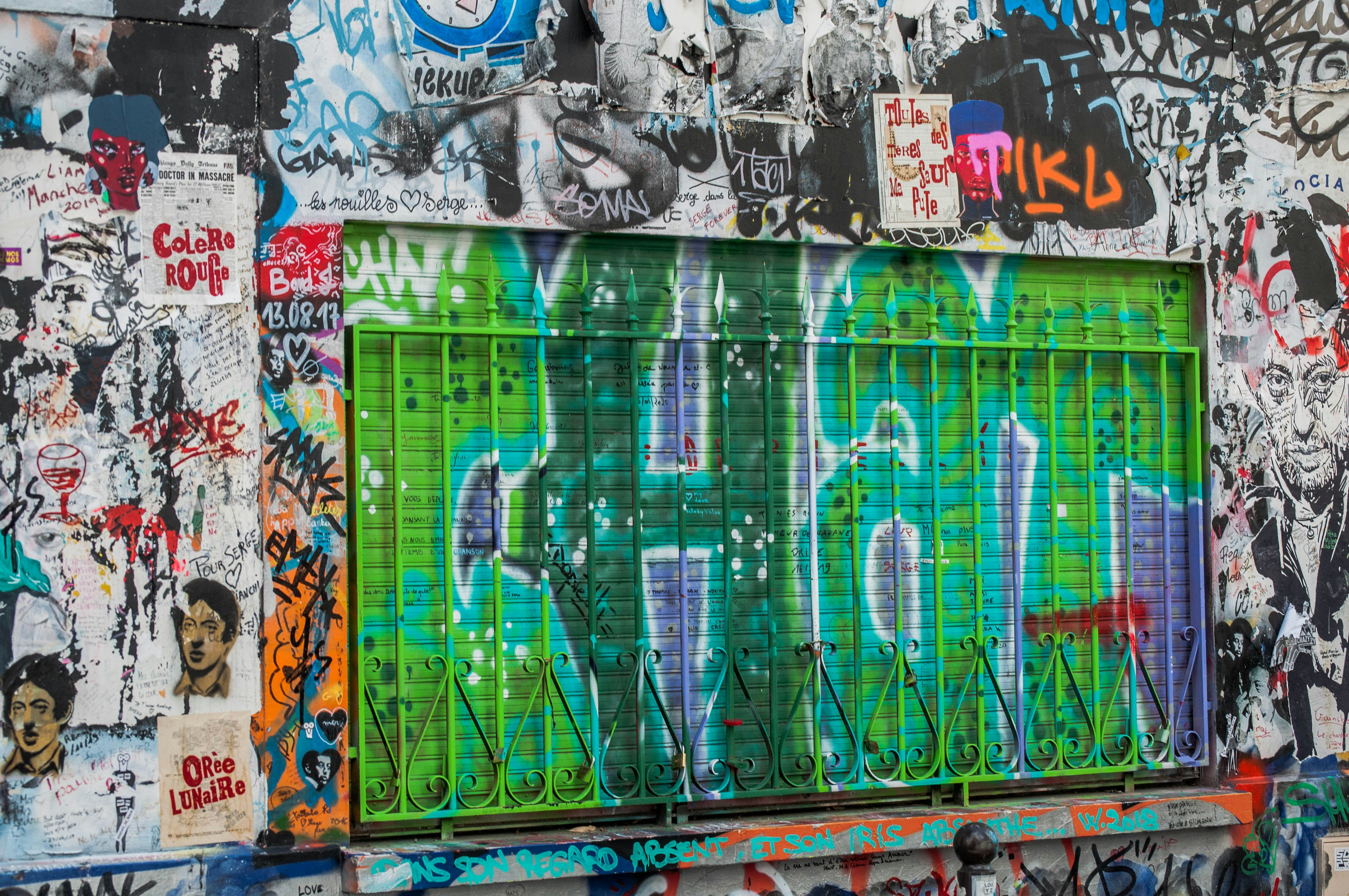 blue and white graffiti on wall